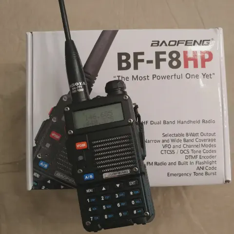 baofeng btech bf f8hp front view with black antenna attached black textured body single control knob lcd display numeric keypad speaker grille