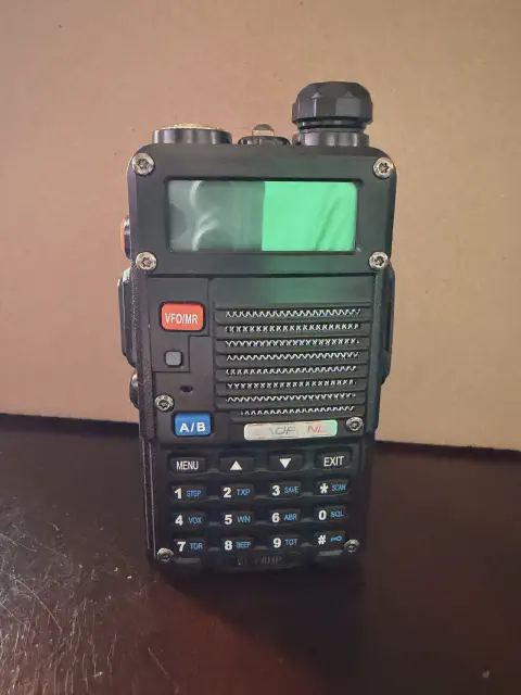 baofeng btech bf f8hp front view without antenna black textured body single control knob lcd display numeric keypad speaker grille