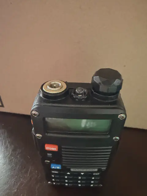 baofeng btech bf f8hp top view showing sma m connector without antenna black textured body single control knob