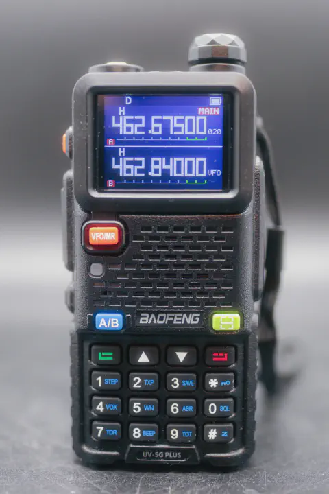 baofeng btech uv 5g plus front view without antenna black textured body single control knob lcd display numeric keypad speaker grille