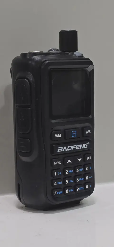 baofeng btech uv 5r mini front view without antenna black smooth and black textured body single control knob lcd display numeric keypad control buttons