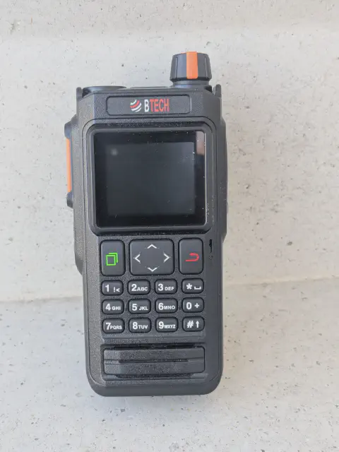 baofeng btech uv pro front view without antenna black textured body single control knob lcd display control buttons numeric keypad speaker grille