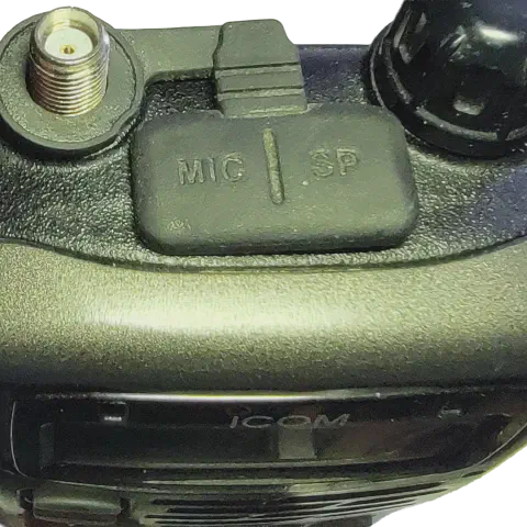icom ic t90a top view showing sma f connector without antenna black textured body single control knob microphone and speacker jack cover