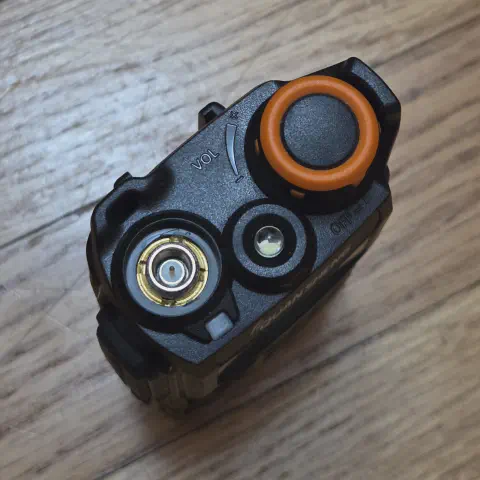 quansheng uvk5 top view showing sma m connector without antenna black textured body single control knob led flashlight