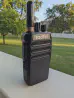 Thumbnail of radtel rt 493 front view with black antenna attached black textured body two control knobs speaker grille
