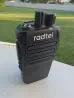 Thumbnail of radtel rt 493 front view showing sma m connector without antenna black textured body two control knobs speaker grille