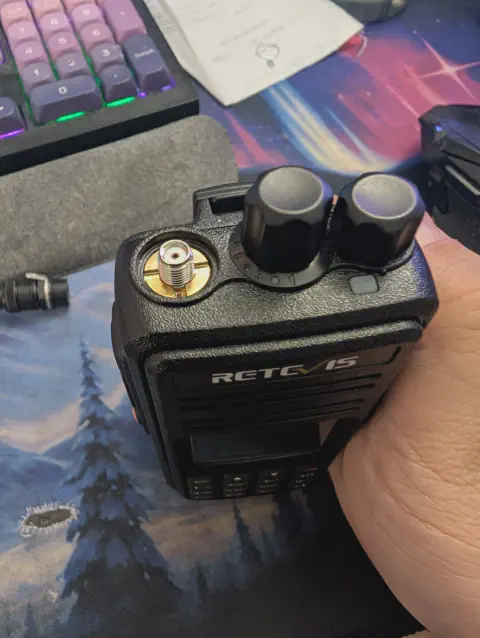 retevis ailunce rt3s top view showing sma f connector without antenna black textured body two control knobs