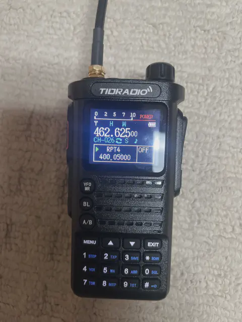 tidradio td h8 front view with black antenna attached black textured body single control knob lcd display speaker grille numeric keypad