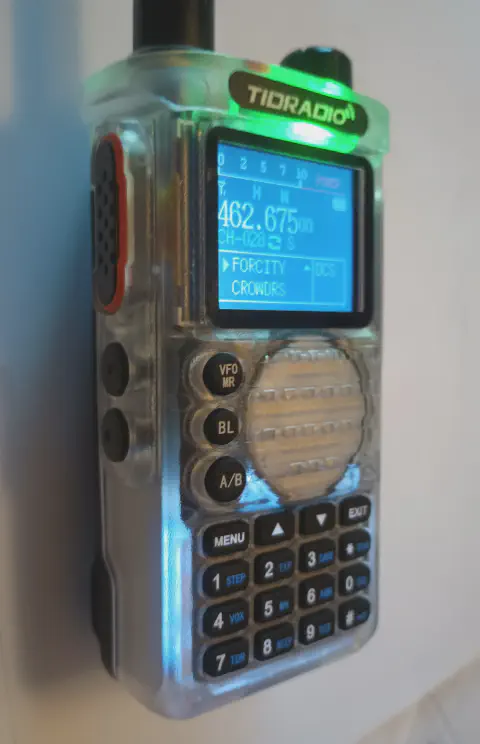 tidradio td h8 front view with black antenna attached white translucent textured body single control knob lcd display speaker grille numeric keypad