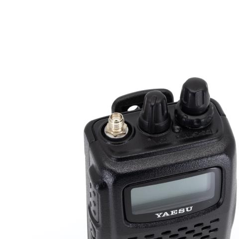 yaesu ft 60 top view showing sma f connector without antenna black textured body two control knobs lcd display