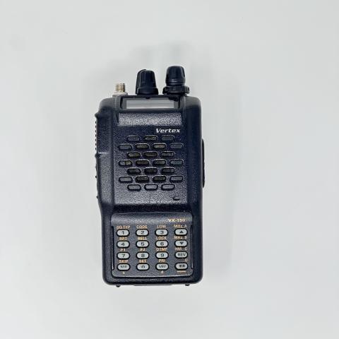 vertex vx150 front view showing sma f connector without antenna black textured body two control knobs lcd display numeric keypad function keys