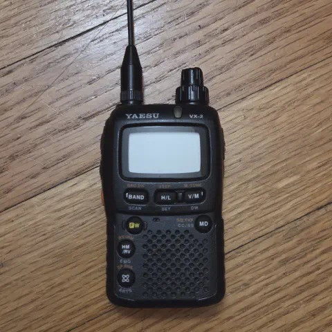 yaesu vertex vx 2r front view with black antenna attached black smooth body single stacked control knob lcd display control buttons speaker grille